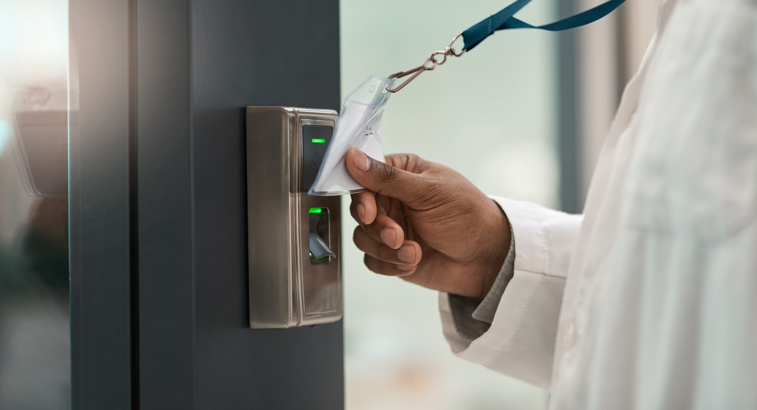 Hand, doctor and machine to scan card for access, secure entry and authentication of restricted area. Person, badge and equipment to verify identity, authorized staff and biosecurity for timekeeping
