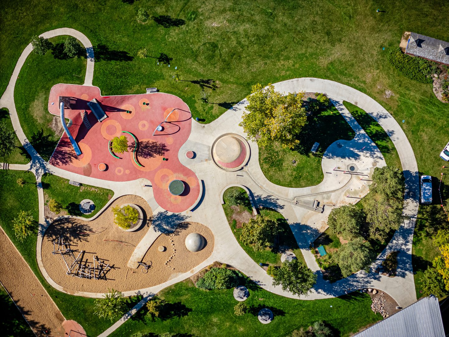 Park with a playground and a car park